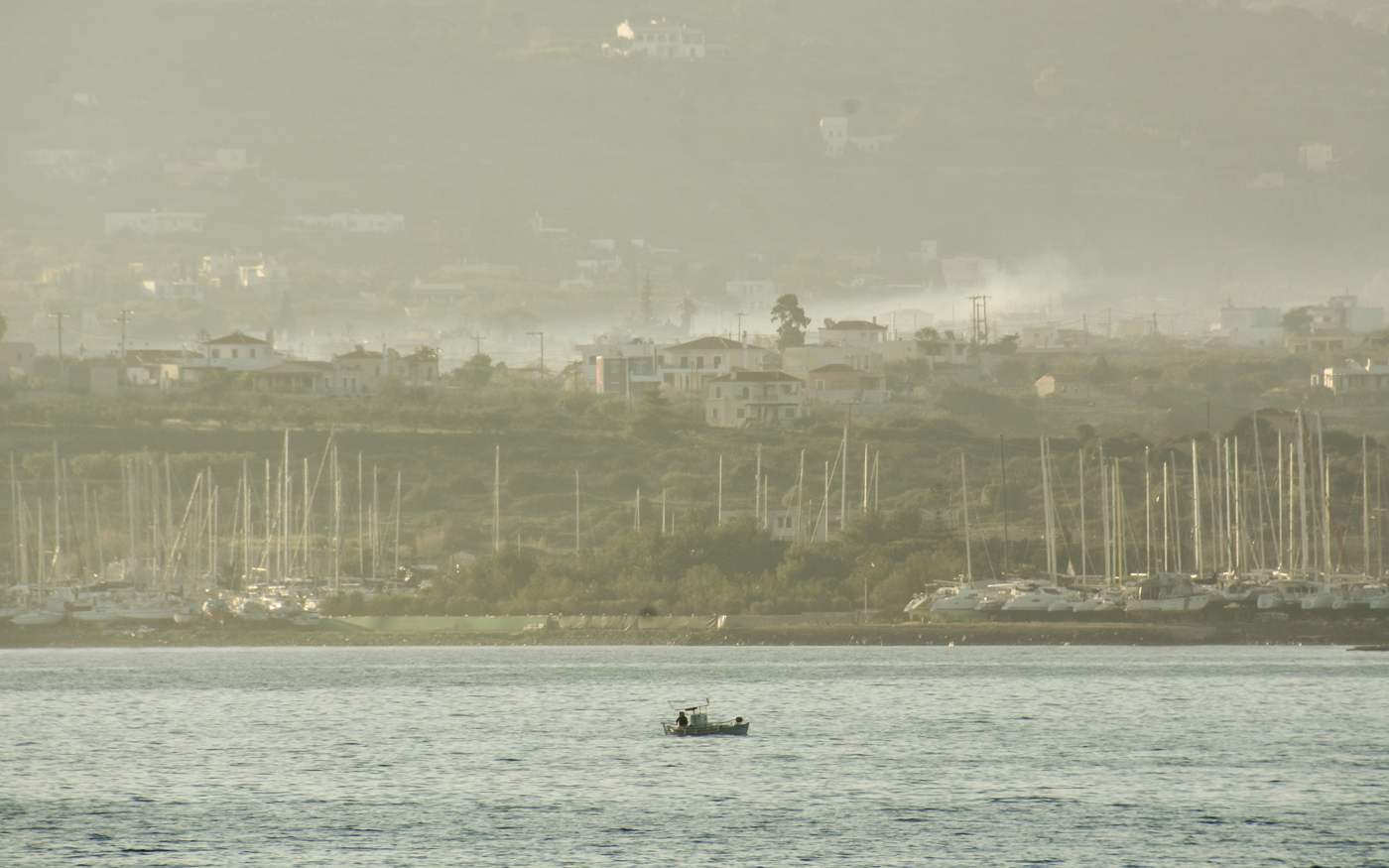 A small fishing boat out on the calm sea off the coast of Aegina