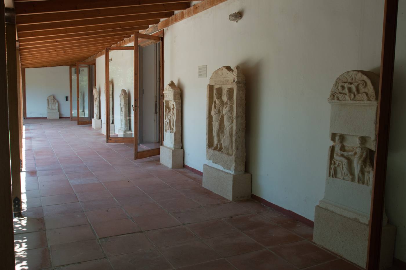 Ancient carved stelae on display in the Archaeological Museum of Aegina
