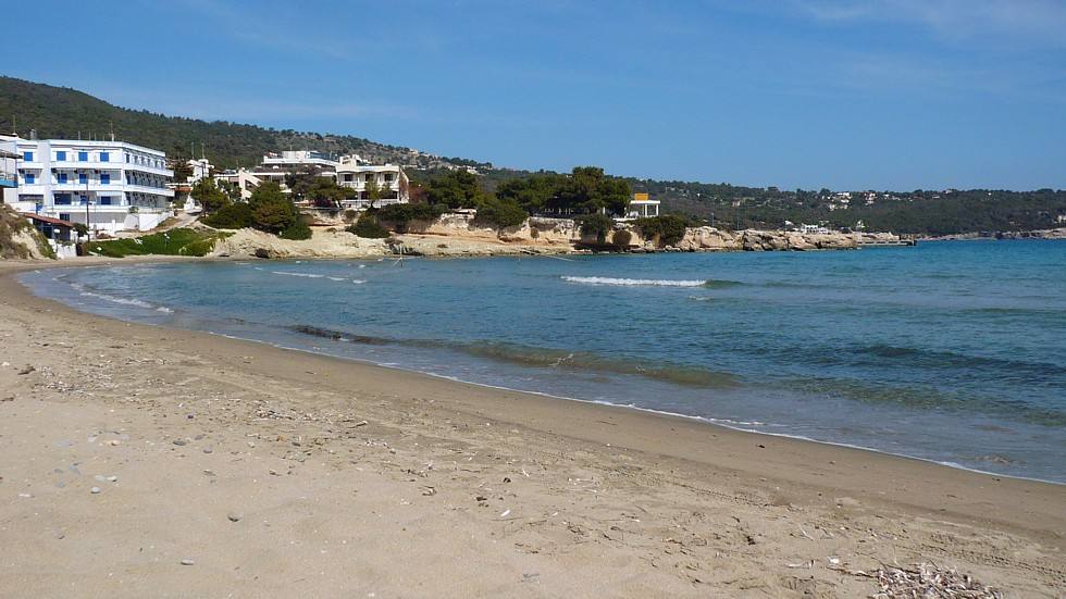The long sandy beach and shallow clear water of Agia Marina on Aegina