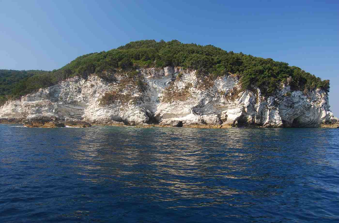 The green, vine-covered island of Antipaxos