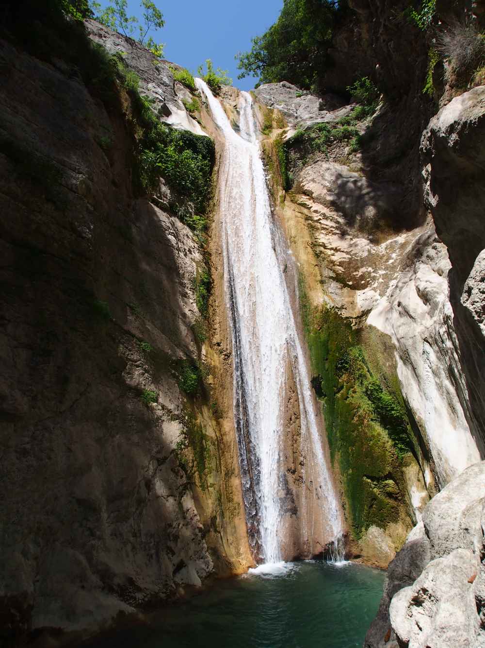 The Dimosari waterfall dropping into its pool in the gorge near Nydri, Lefkada