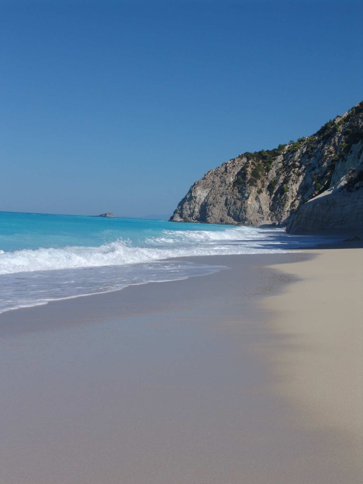 The pale shore and white cliff headland of Egremni beach, Lefkada