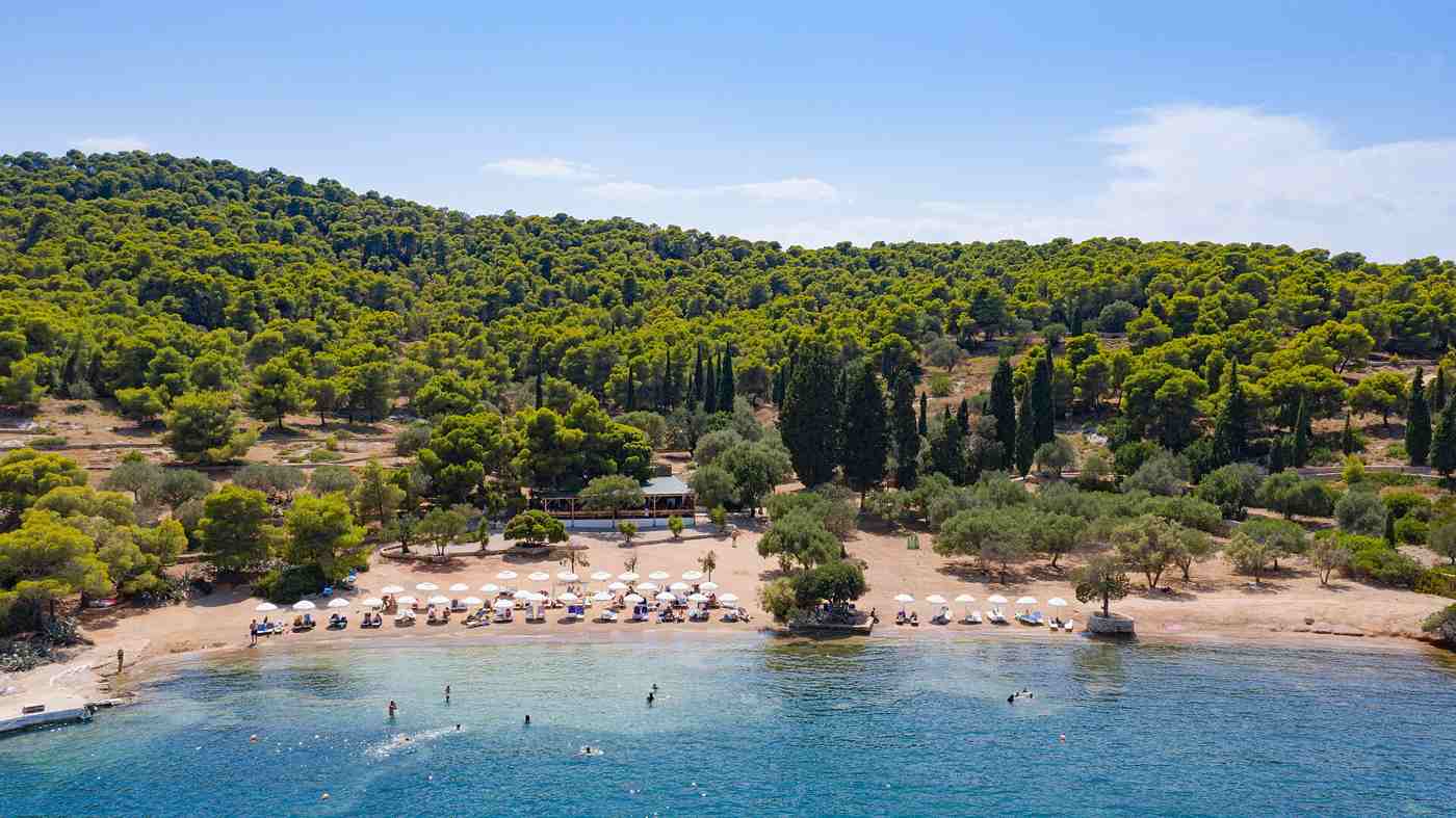 Spetses, Greece — A view from the sea of Zogeria Beach on Spetses, Greece (487