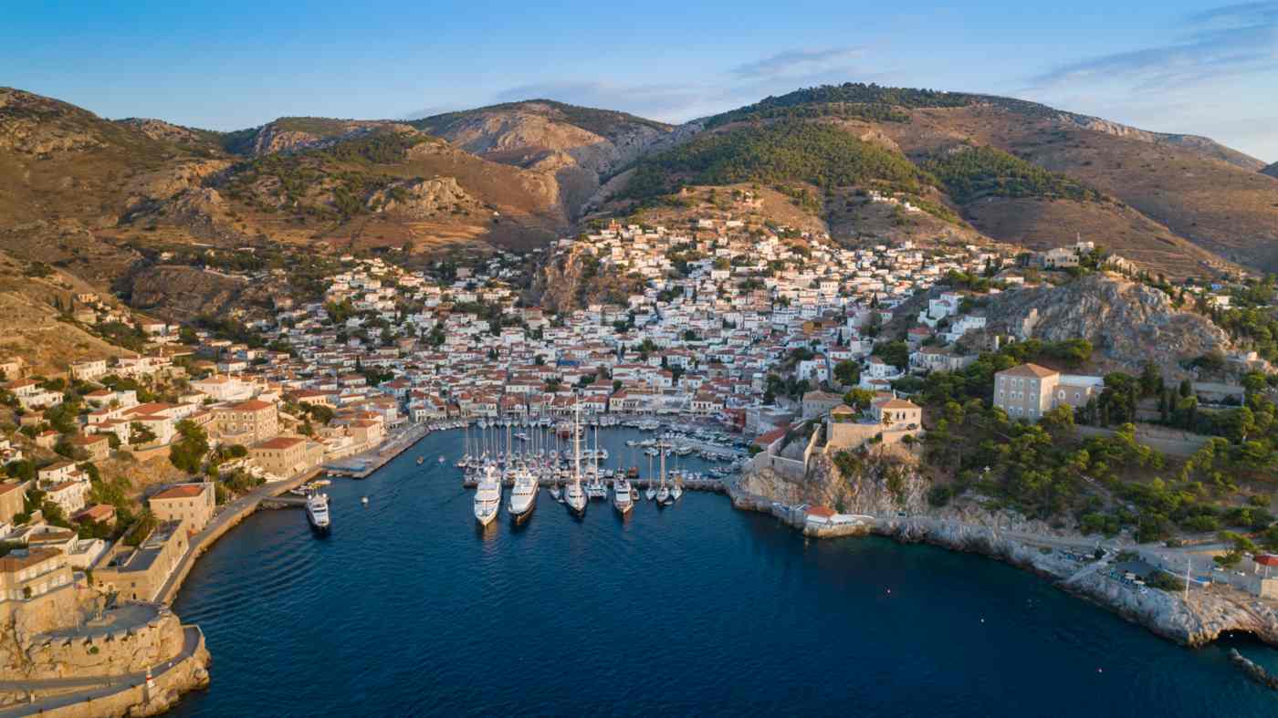 Hiking in Hydra: the town below pine-clad mountains, whose paths and trails climb from the harbour