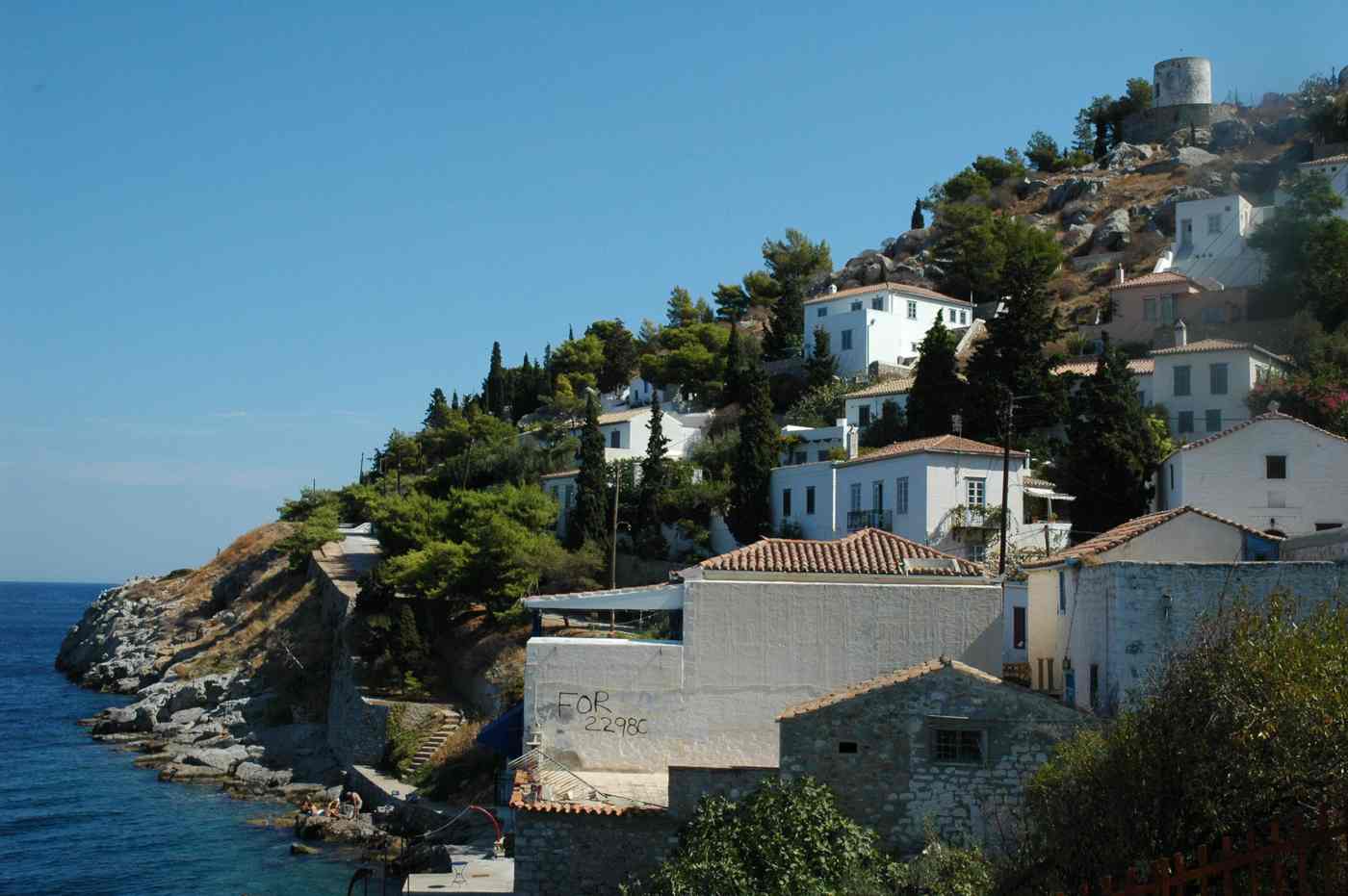 The stone coastal path at Kamini, one of the easiest walks when hiking in Hydra