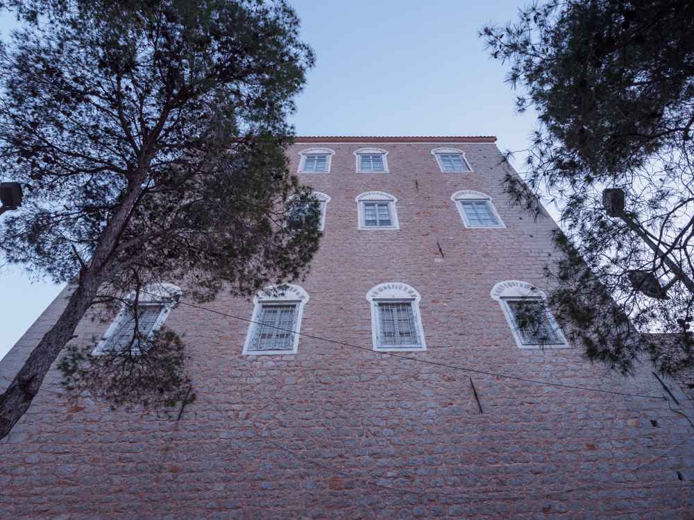 A tall stone captain's mansion on Hydra, one of the island's historic archontika