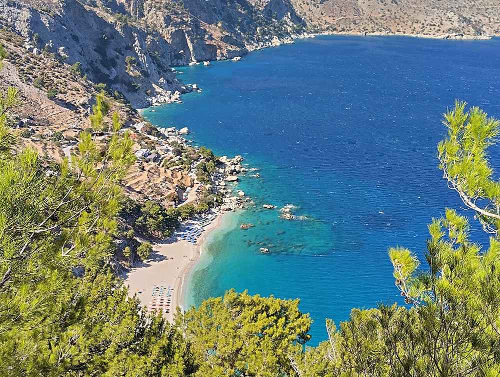 Apella beach and its pine-clad cove on the east coast of Karpathos
