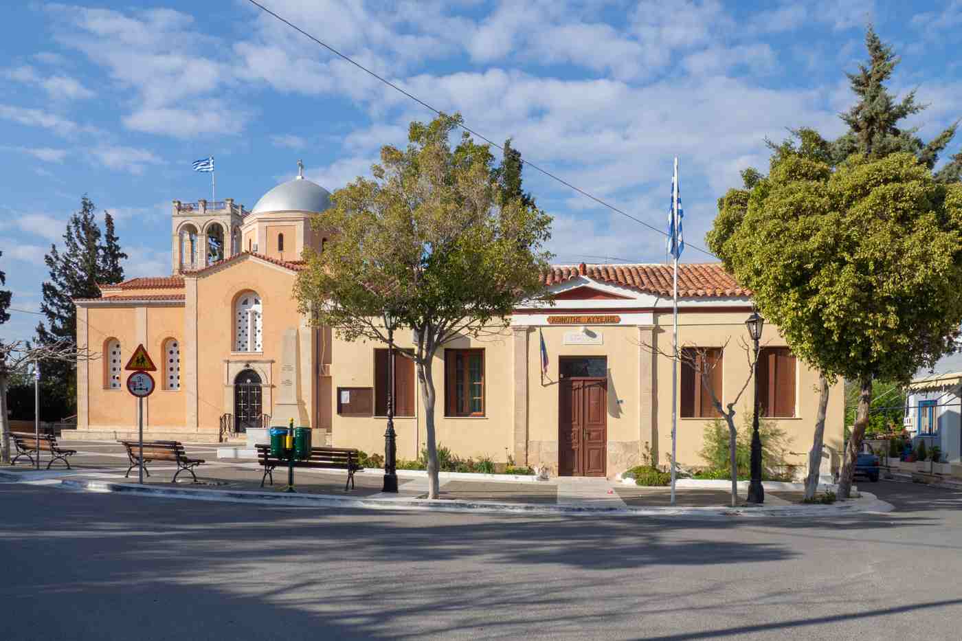 The main square of Kypseli with its church and old village hall, Aegina