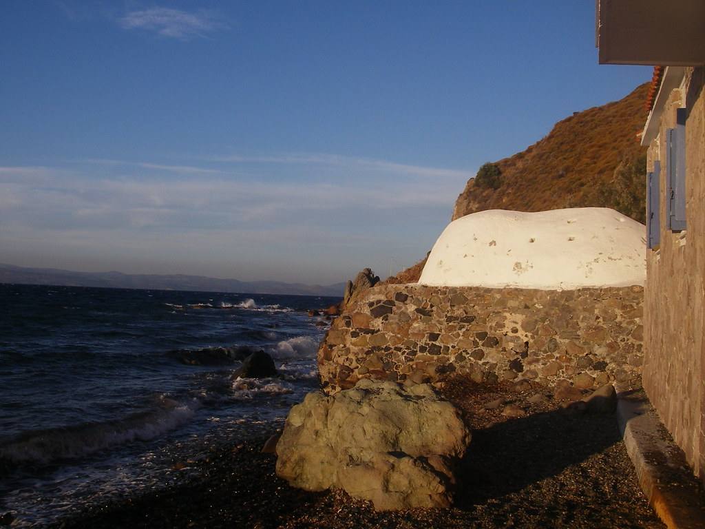 The domed stone bathhouse of the Eftalou hot springs beside the sea on the north coast of Lesbos