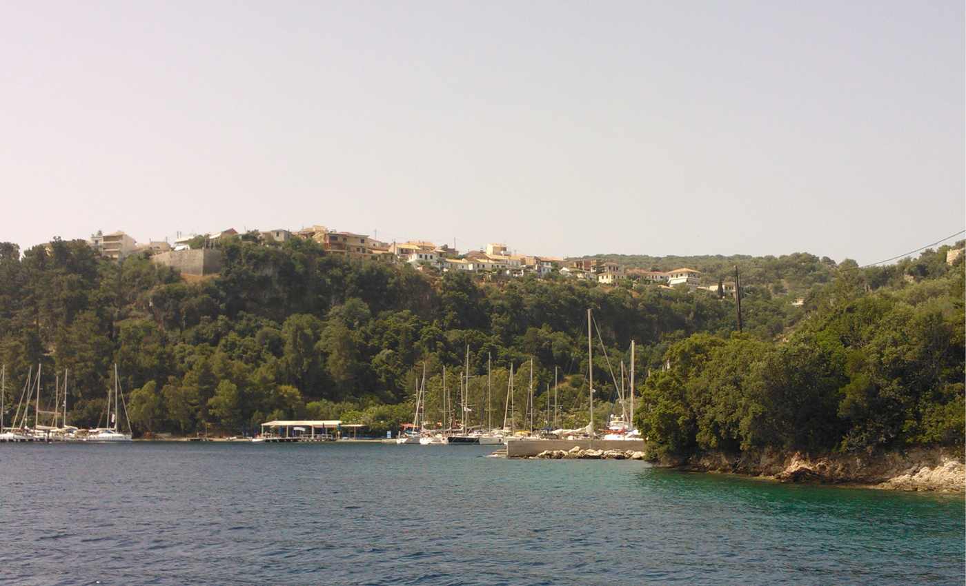 Yachts below the clifftop village of Spartochori on Meganisi, off Lefkada