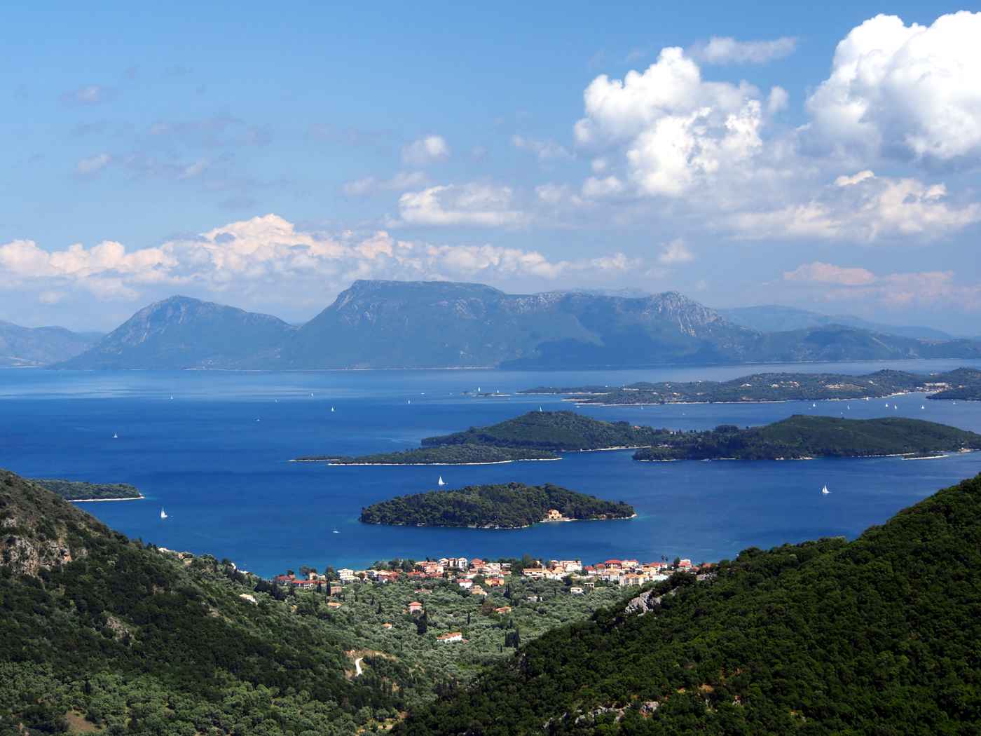The offshore islets off Nydri, including Skorpios and Madouri, Lefkada