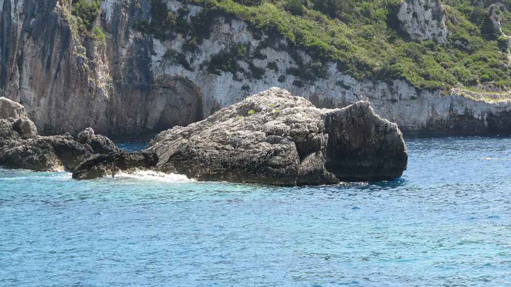 A clear turquoise cove on the coast of Paxos
