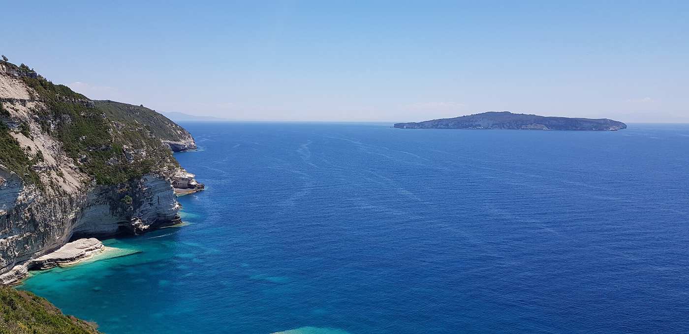 The view past the Tripitos arch towards Antipaxos