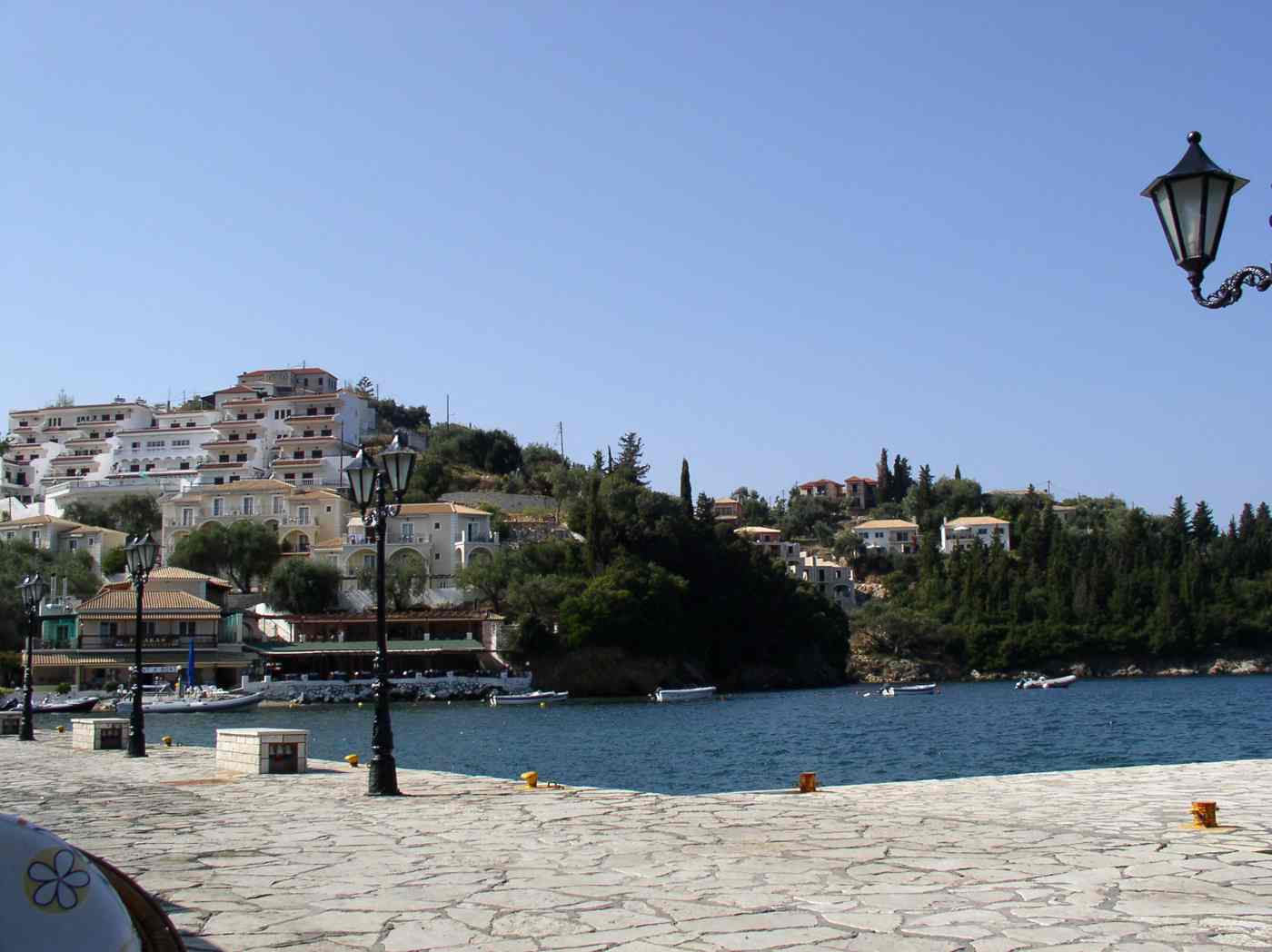 The sheltered horseshoe harbour of Sivota below its hillside village, Lefkada