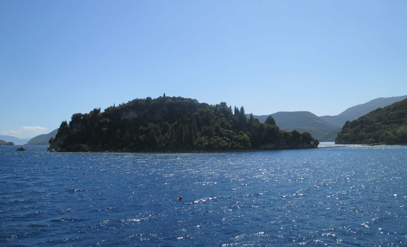 Skorpios island, the green private Onassis islet, seen from the sea off Lefkada