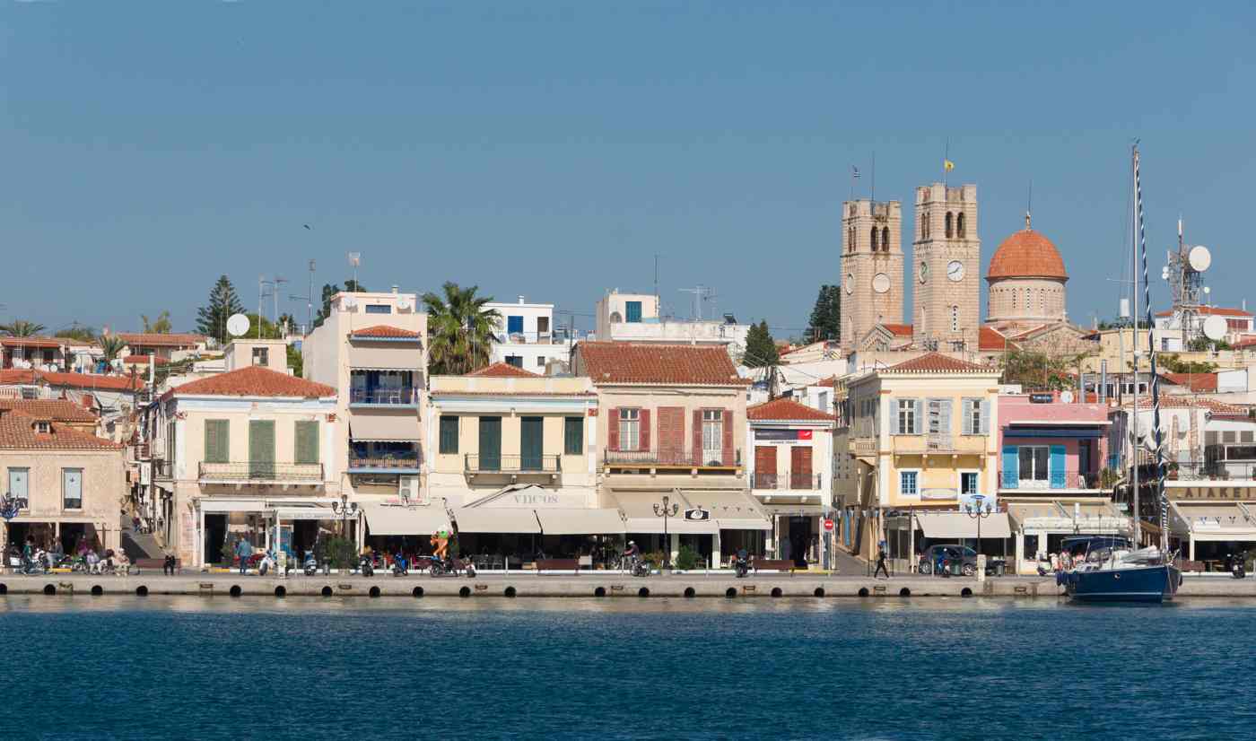 The waterfront of Aegina Town, its neoclassical houses, cathedral and harbour cafes