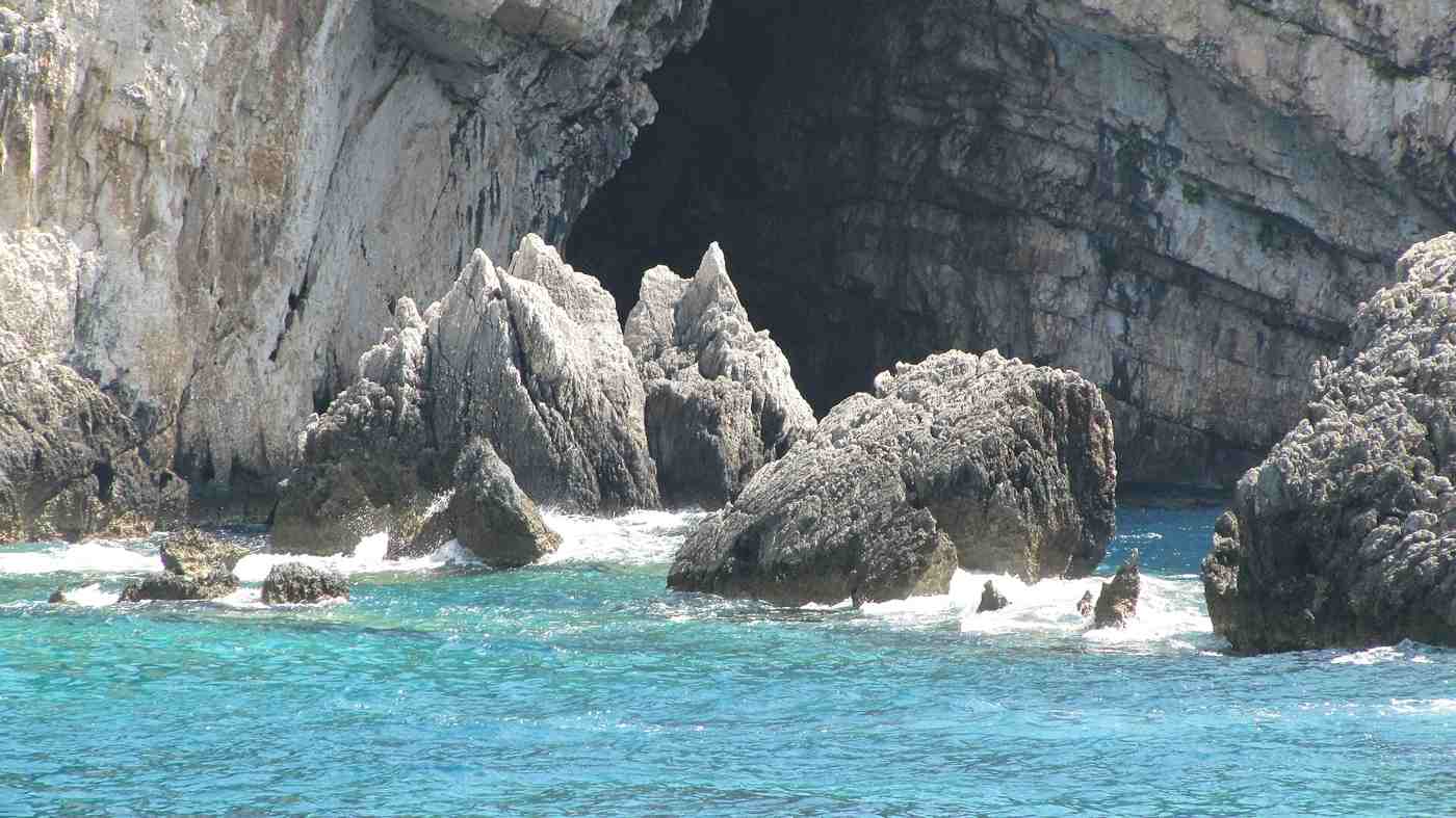 The dramatic cliffs and sea caves of the Paxos coast