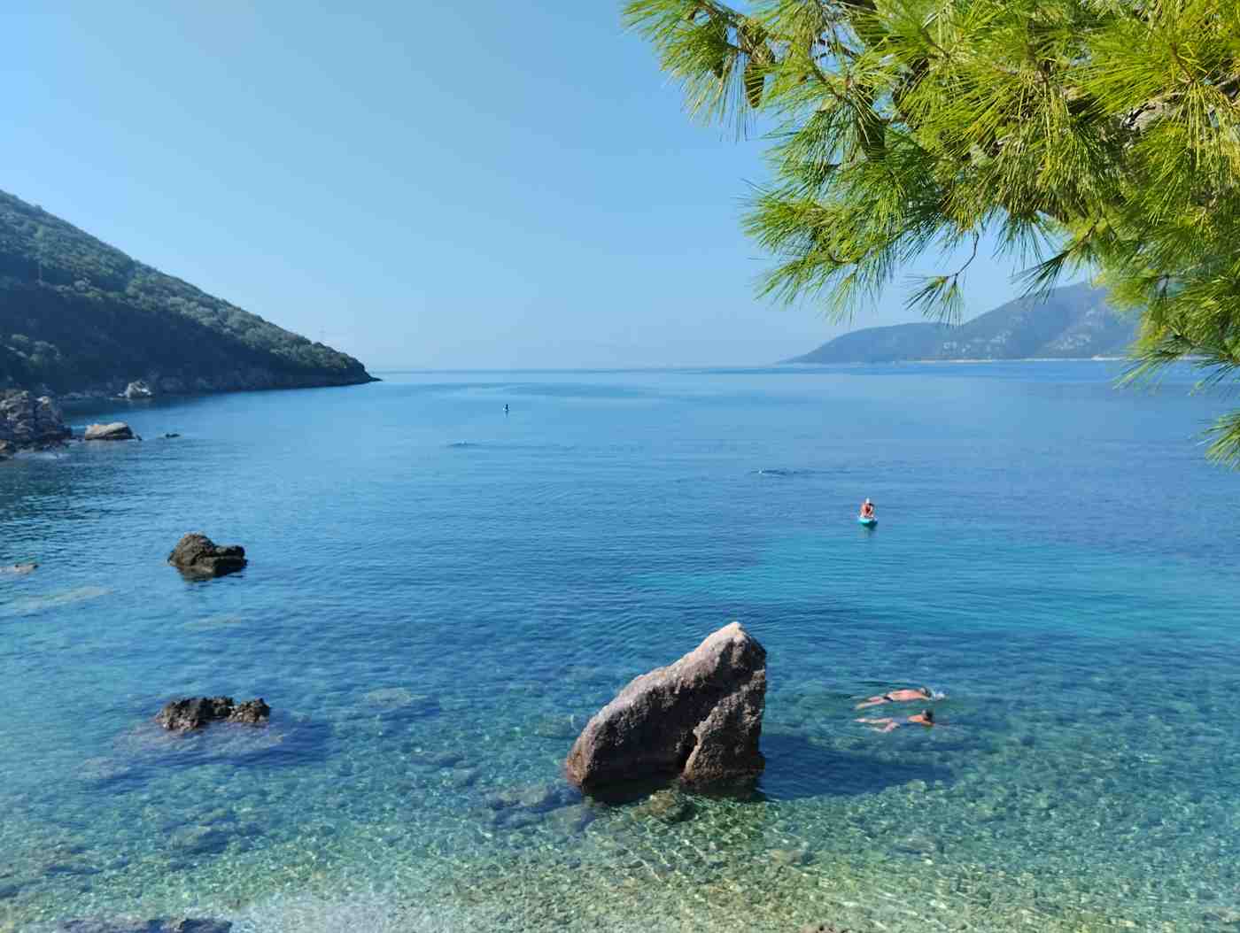 Clear shallow water along the shore at Vasiliki bay, Lefkada