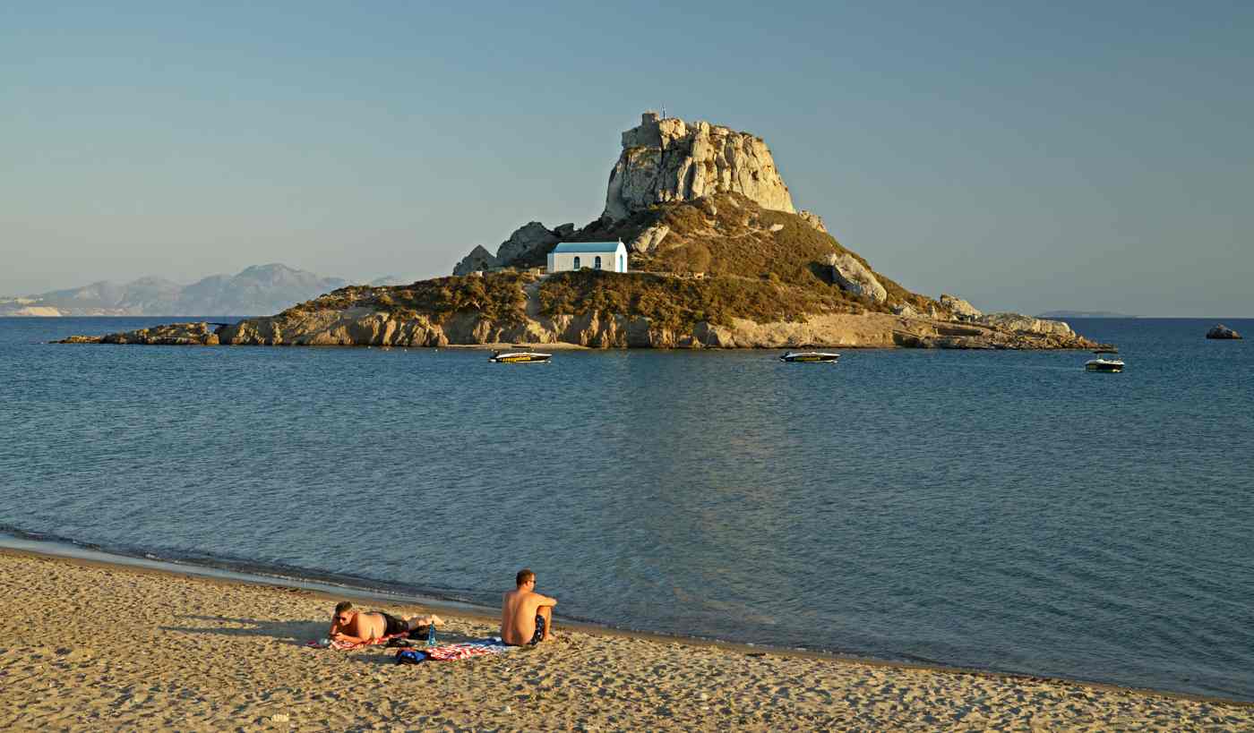 Kefalos beach. Kastri island and chapel of St. Nicholas. Kos, Greece