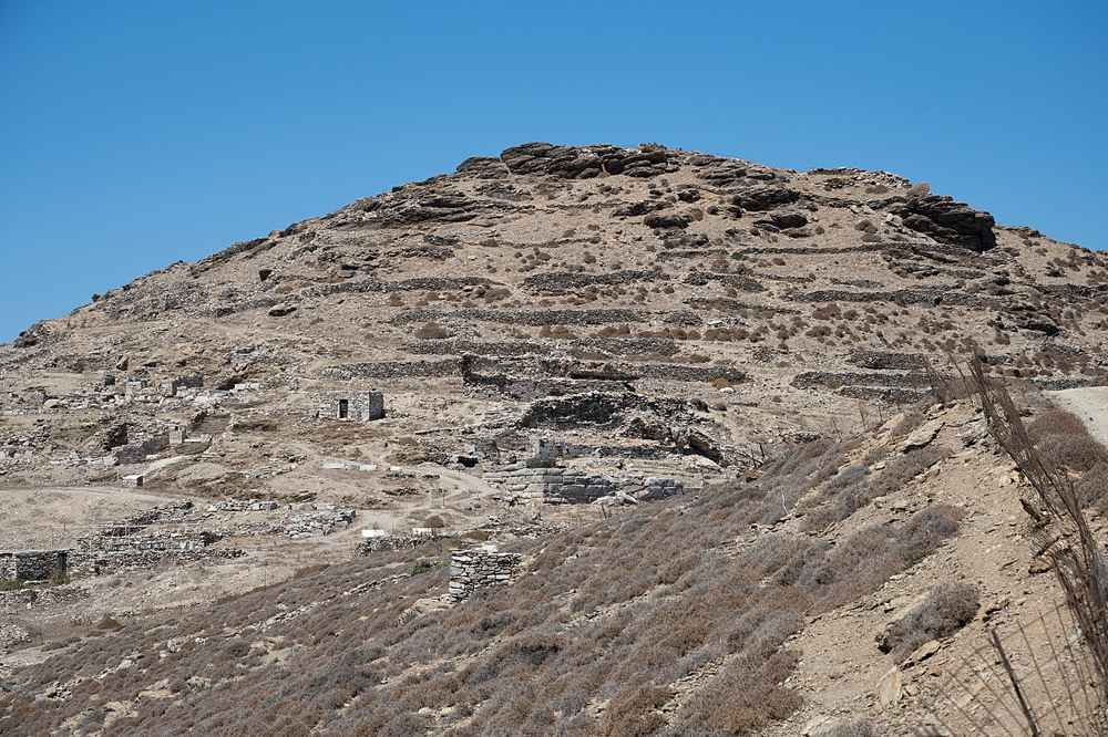 The terraced ruins of the ancient acropolis of Minoa on its hill above the port of Katapola, Amorgos