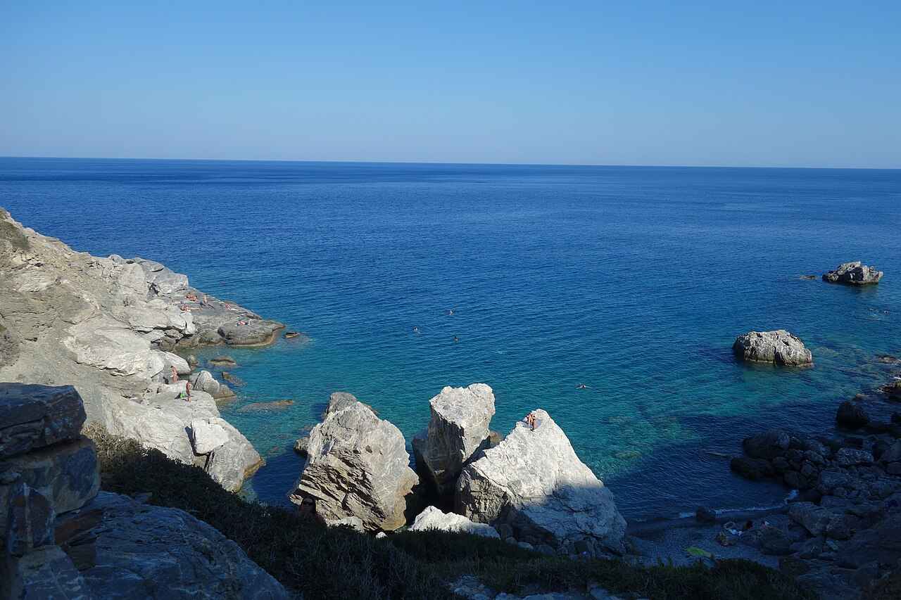The deep turquoise water of Agia Anna cove on Amorgos, the beach of Luc Besson's film The Big Blue