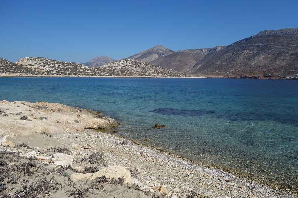 The clear turquoise water of a beach on the islet of Nikouria, reached by boat off the north coast of Amorgos