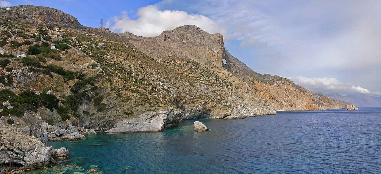 The dramatic cliff-bound east coast of Amorgos, the kind of scenery a hire car opens up across the island