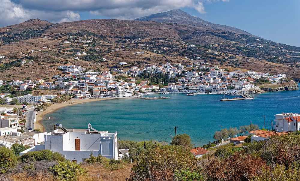 An elevated view over the turquoise bay and harbour of Batsi on the west coast of Andros