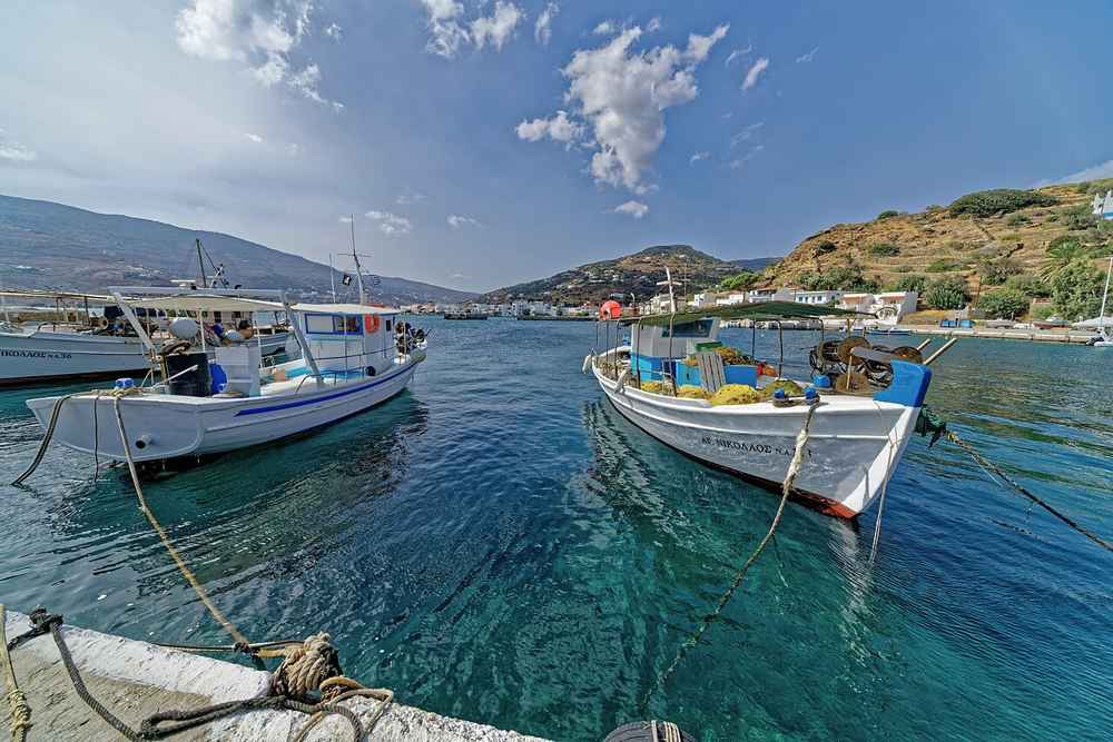 Fishing boats moored in a sheltered Andros harbour, a departure point for coastal boat trips