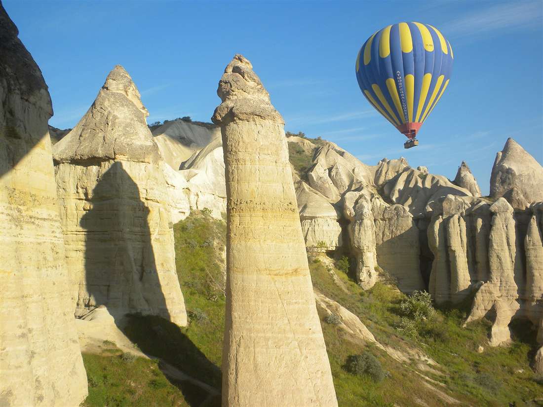 A hot air balloon over the fairy chimneys of Cappadocia