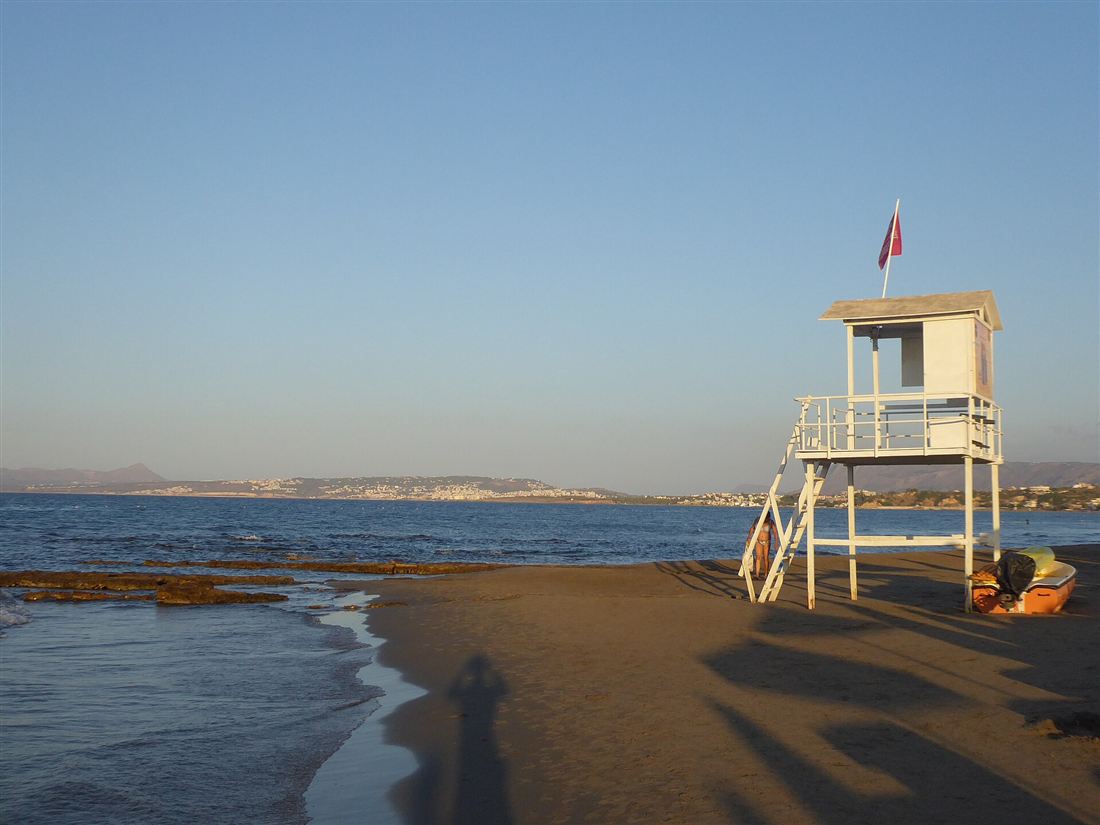 A sandy family beach with a lifeguard station near Chania, good for kids