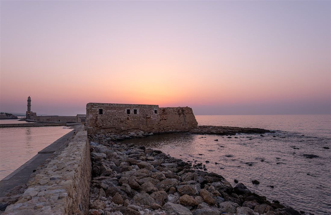 The Chania Venetian harbour and Egyptian lighthouse at sunset