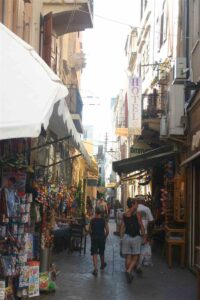 A shopping alley in the Chania old town with souvenir stalls and tavernas