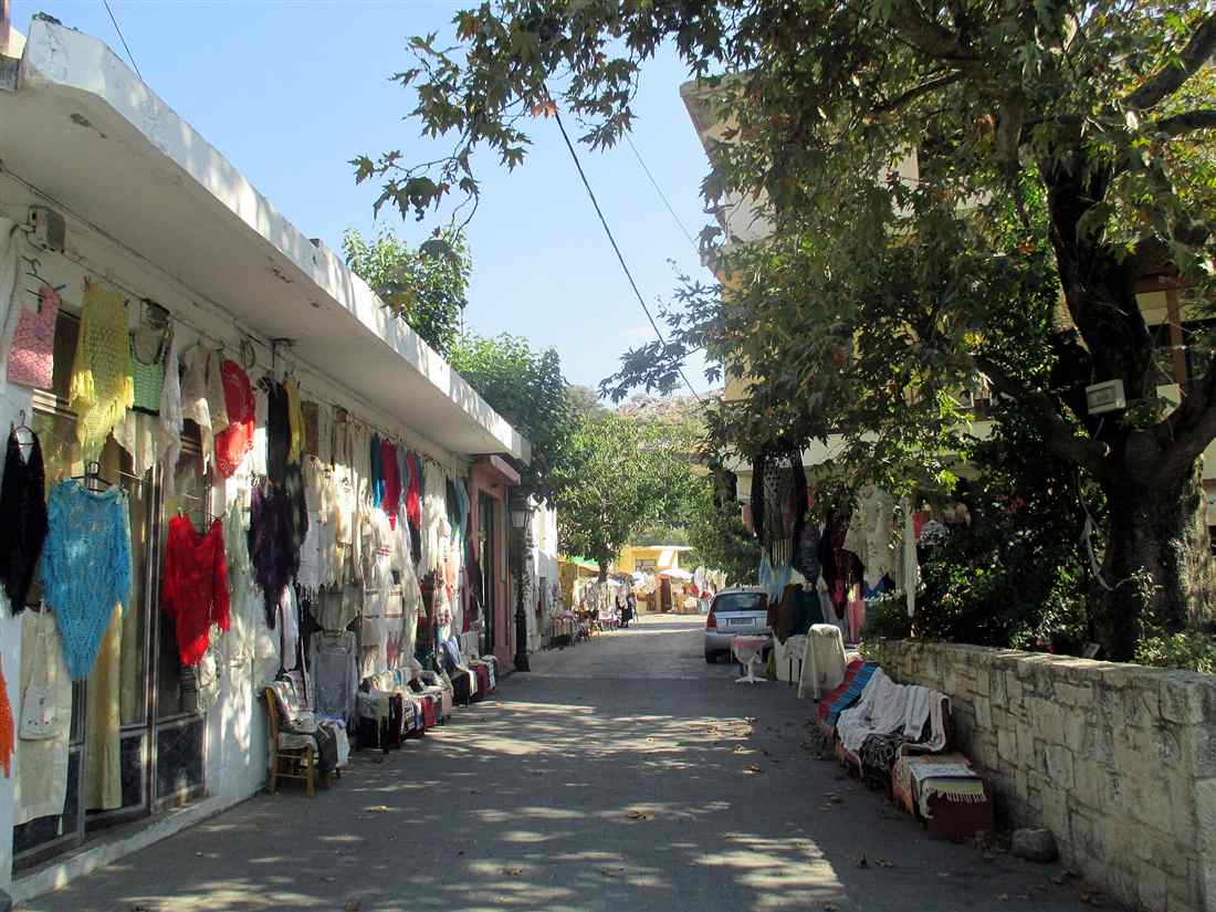 A craft lane in Anogia on Mount Psiloritis, hung with the handwoven textiles the mountain village is known for