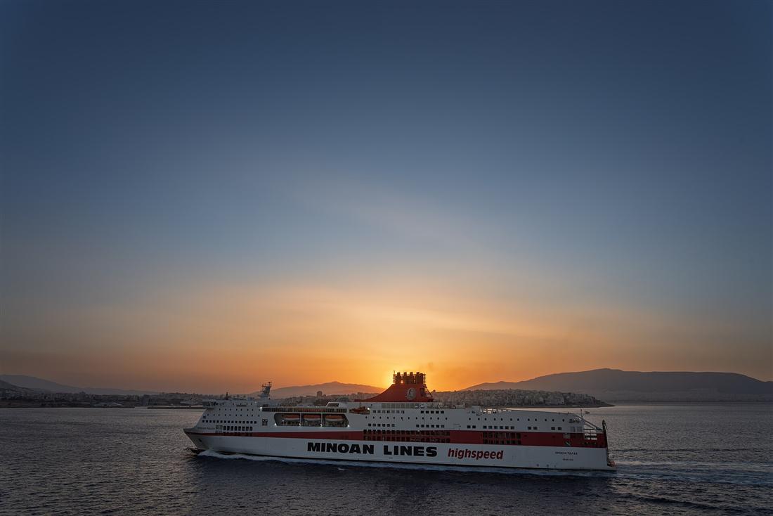 A Minoan Lines overnight ferry off Piraeus at sunset, the crossing between Crete and Athens