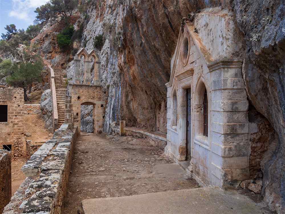The ruined Katholiko monastery carved into the gorge rock below Gouverneto on the Akrotiri peninsula, Crete