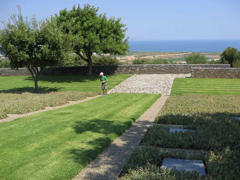 The lawns and graves of the German War Cemetery at Maleme, Crete, looking over the coastal plain to the sea