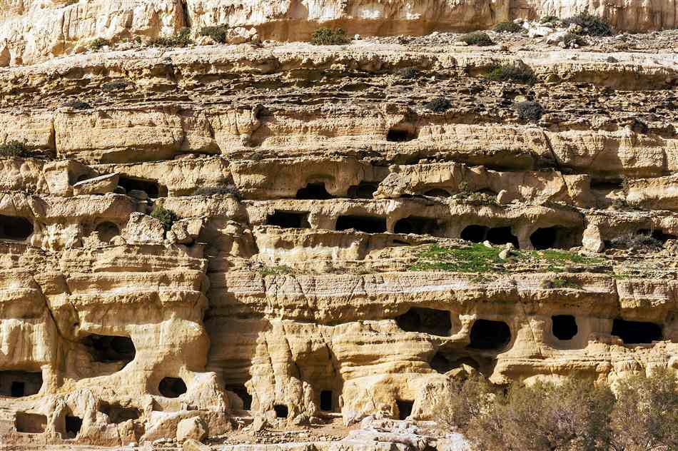 The sandstone cliff of caves above the beach at Matala, Crete