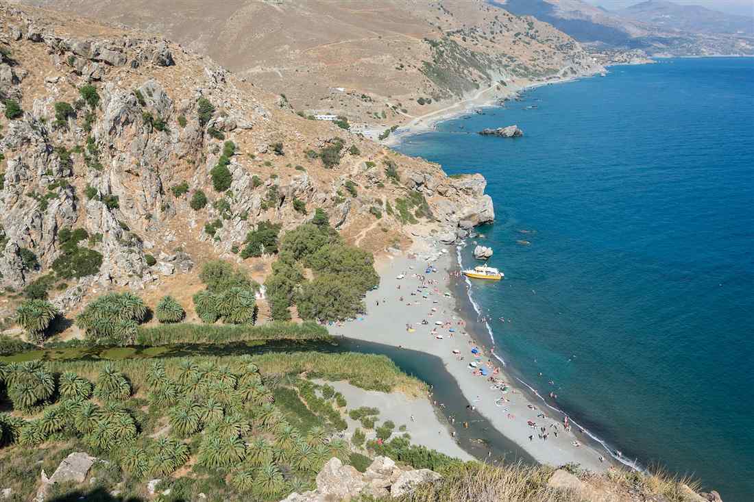 Preveli palm beach, Crete: the Megalopotamos river, the palm forest and the sandbar meeting the Libyan Sea, seen from the cliff path