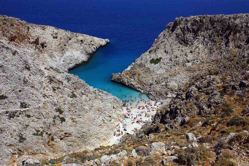 The turquoise fjord-like inlet of Seitan Limania beach between sheer cliffs on the Akrotiri peninsula of Crete