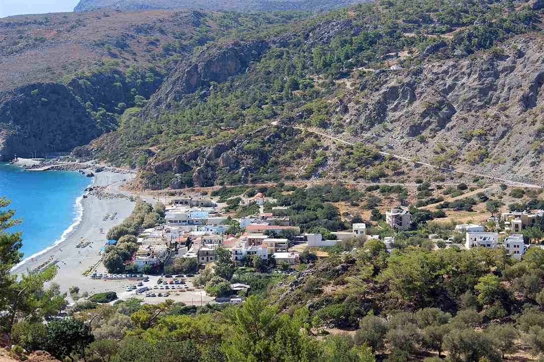 Sougia village and its long pebble beach on the Libyan Sea coast of Crete, seen from the hills