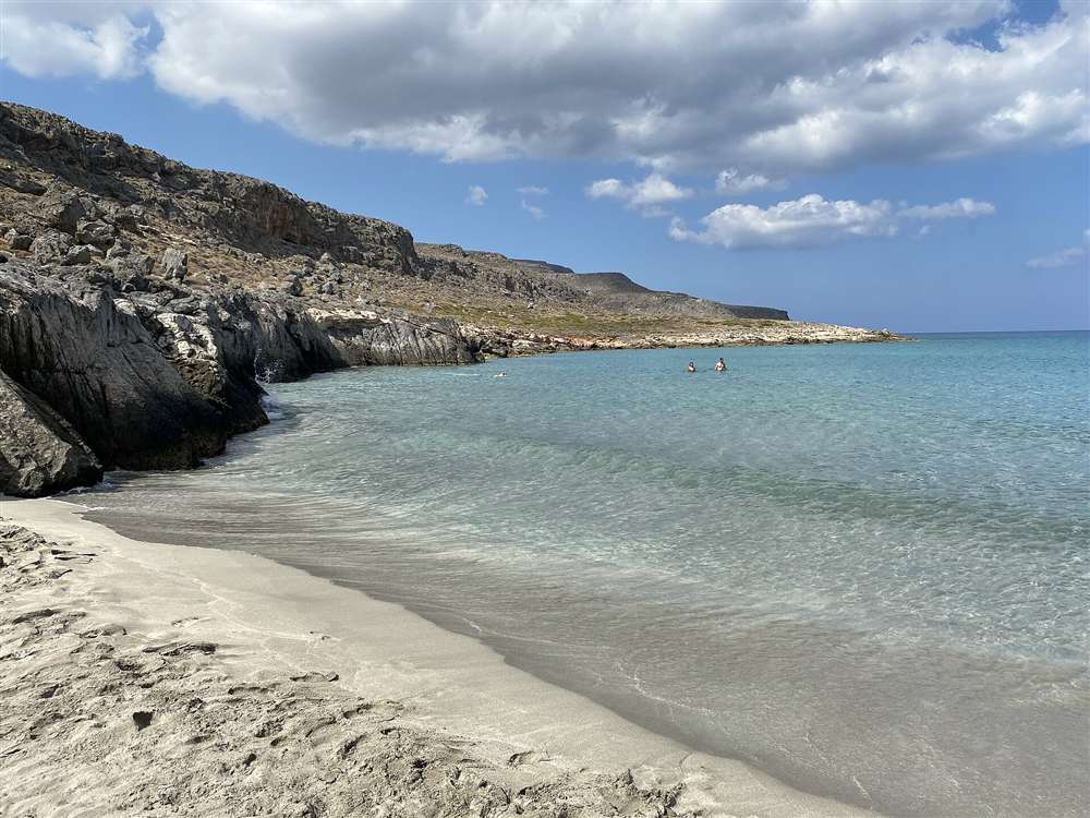A clear turquoise beach backed by rock at Xerokambos in the far south-east of Crete