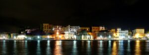 The Chania old harbour waterfront lit up at night