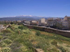 Chania town with the snow-capped White Mountains behind in spring