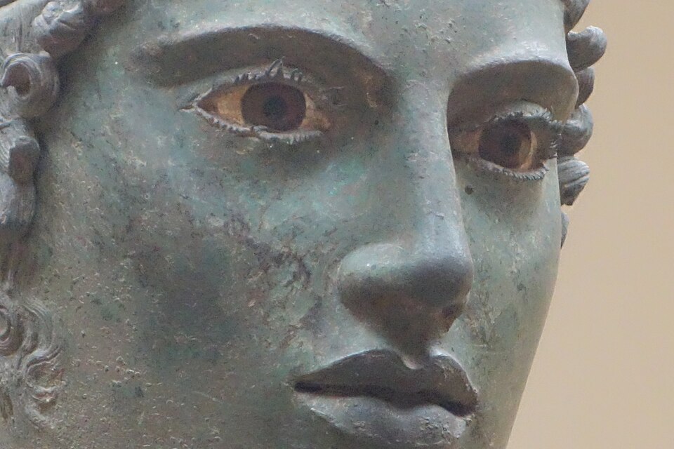The bronze Charioteer of Delphi with its inlaid glass-paste eyes, in the Delphi Archaeological Museum