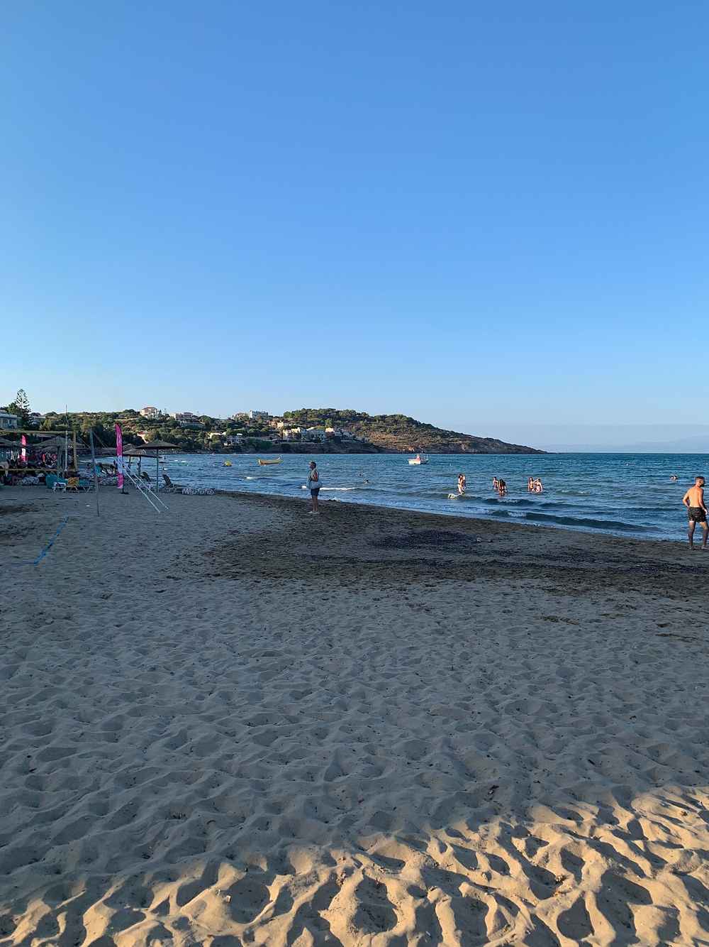 The sandy beach of Karfas in the warm evening light, Chios