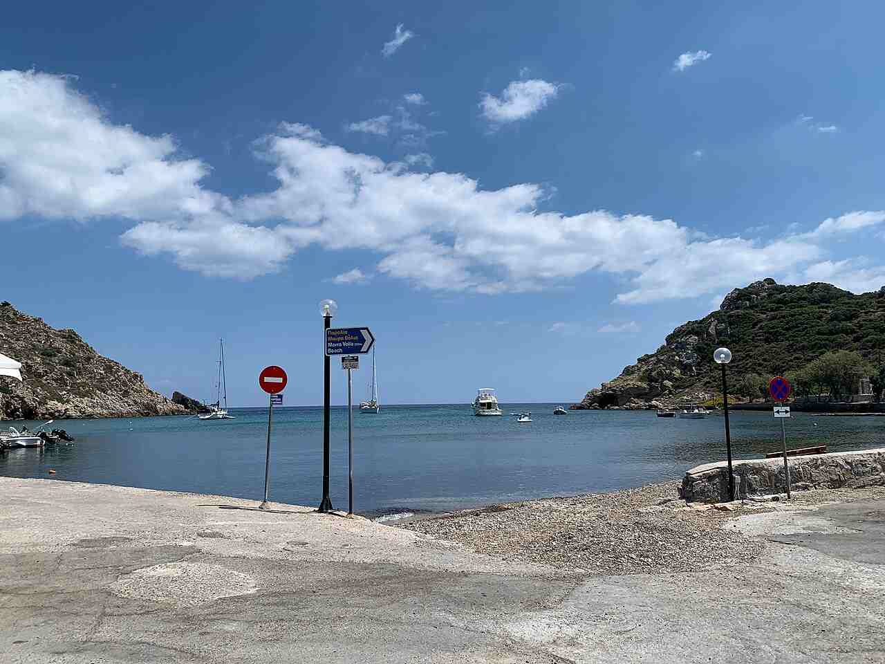 The harbour at Emporios with the sign to Mavra Volia beach, Chios
