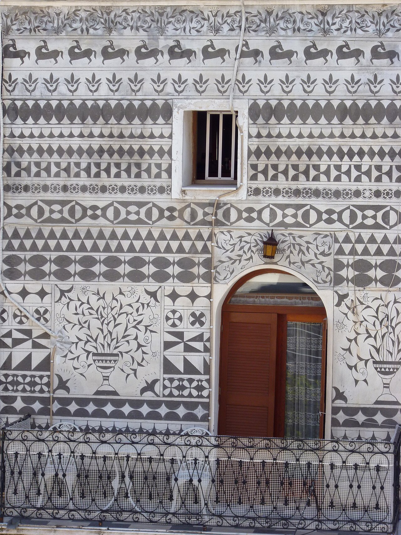 A house facade covered in xysta geometric patterns in Pyrgi, Chios
