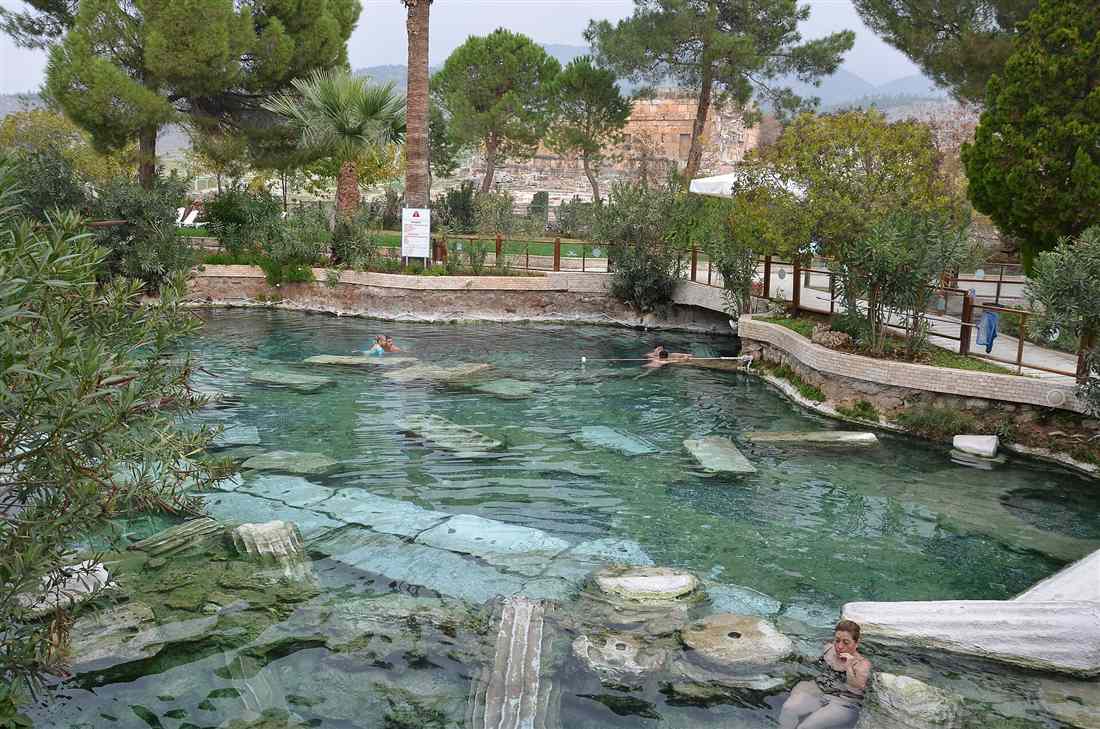 Swimmers among the submerged columns of Cleopatra's Pool at Pamukkale