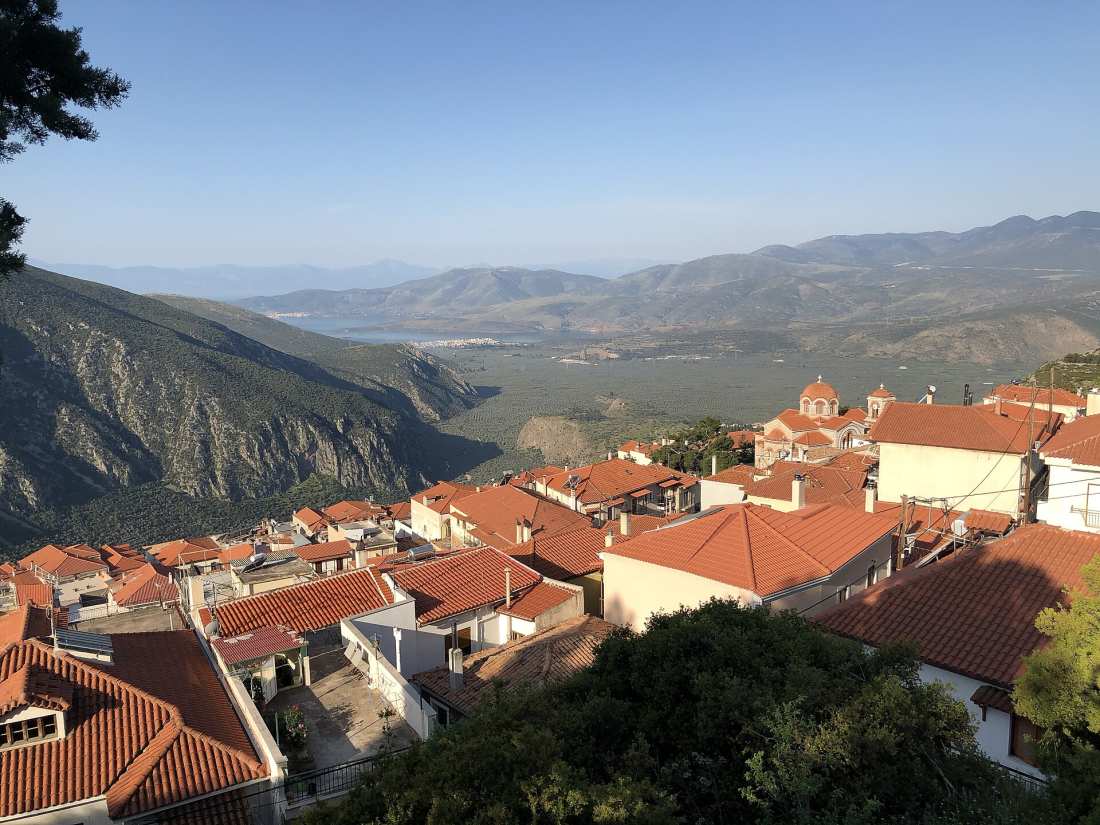 The red-tiled rooftops of the modern village of Delphi above the Pleistos valley and the Gulf of Corinth